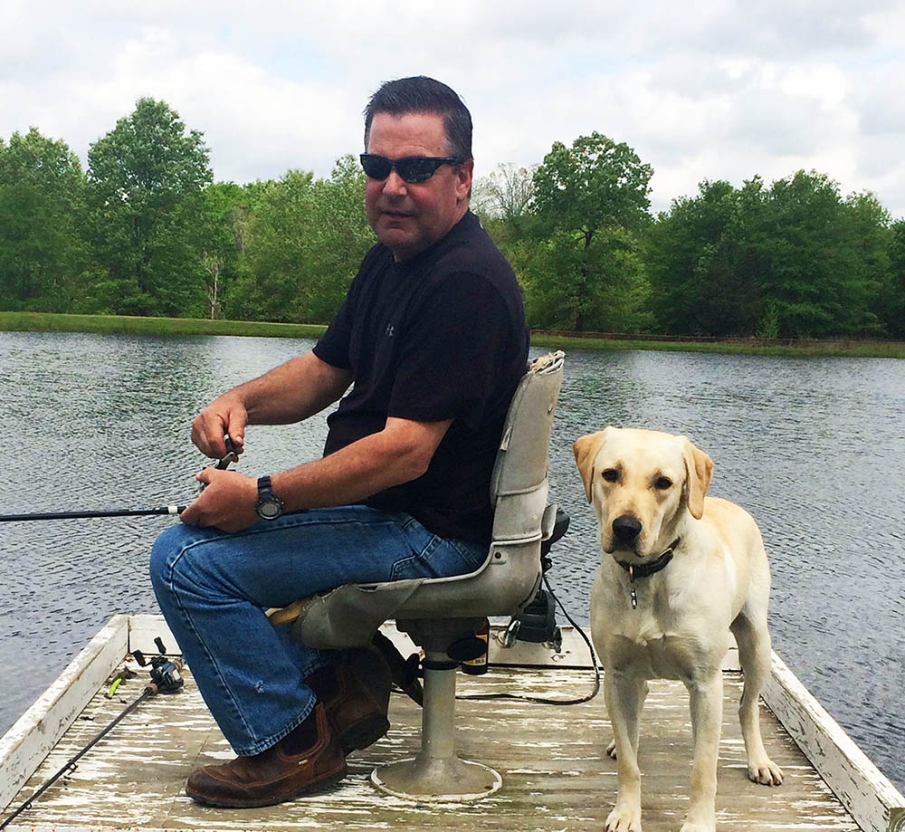 Stephen Ferguson, one of our licensed home inspectors, and his dog Scout